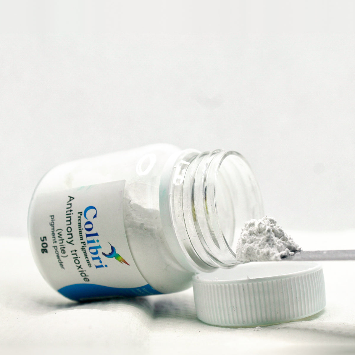 Antimony trioxide pigment powder, open jar