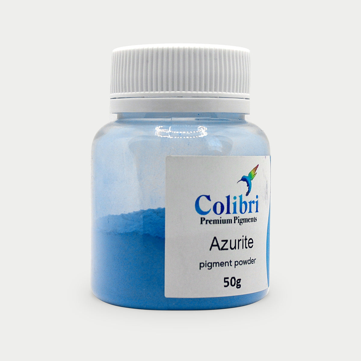 Azurite pigment powder in a Colibri jar