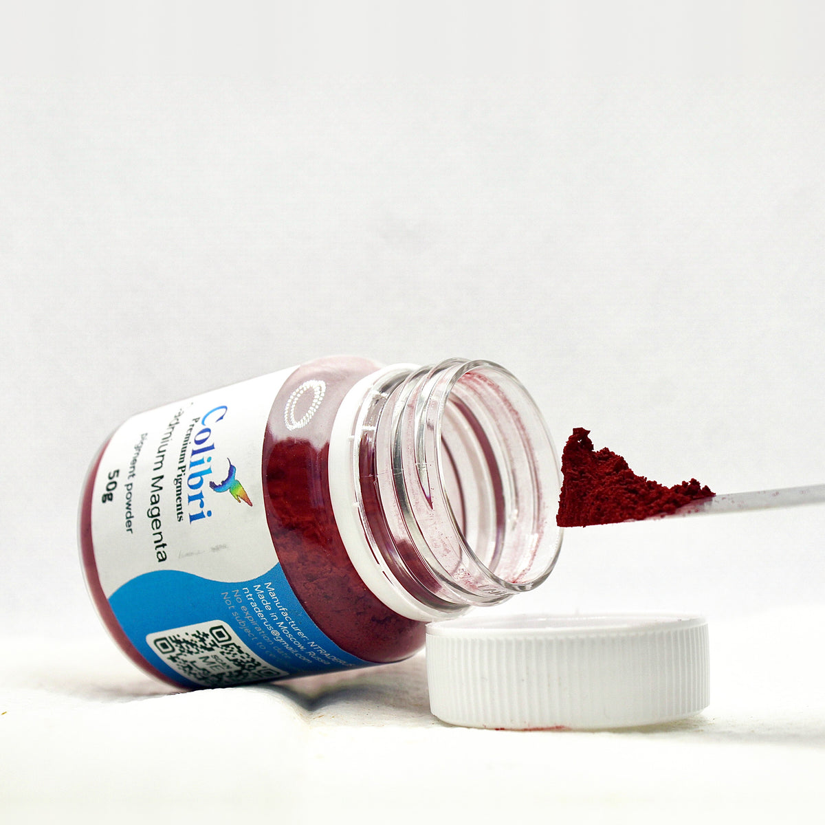 Cadmium magenta pigment powder, open jar