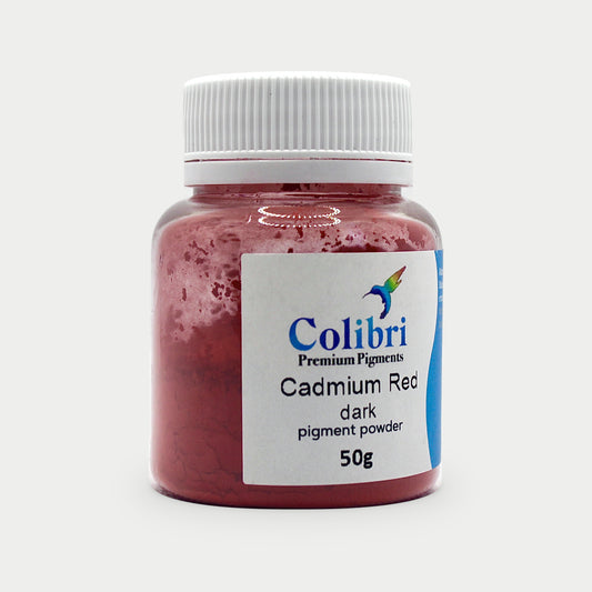 Cadmium red dark pigment powder in a Colibri jar