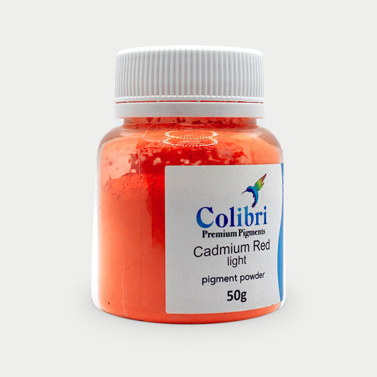 Cadmium red light pigment powder in a Colibri jar