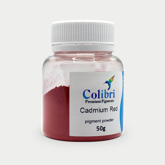 Cadmium red pigment powder in a Colibri jar