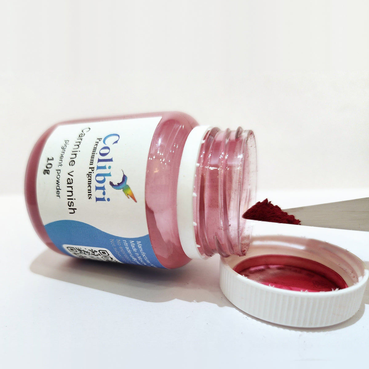 Carmine varnish pigment powder, open jar