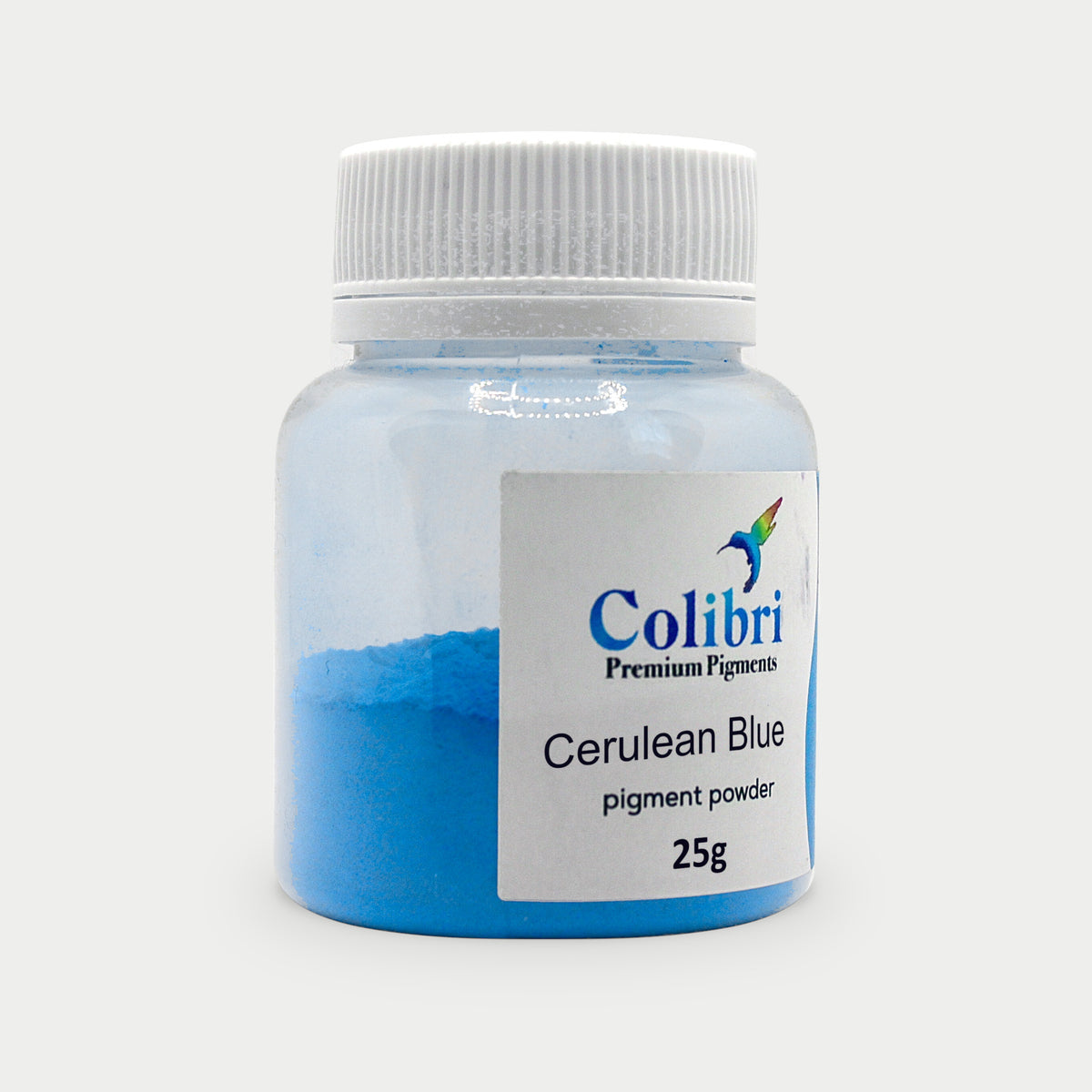 Cerulean blue pigment powder in a Colibri jar
