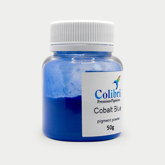 Cobalt blue pigment powder in a Colibri jar