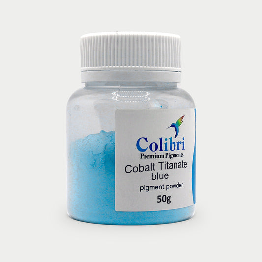 Cobalt titanate blue pigment powder in a Colibri jar