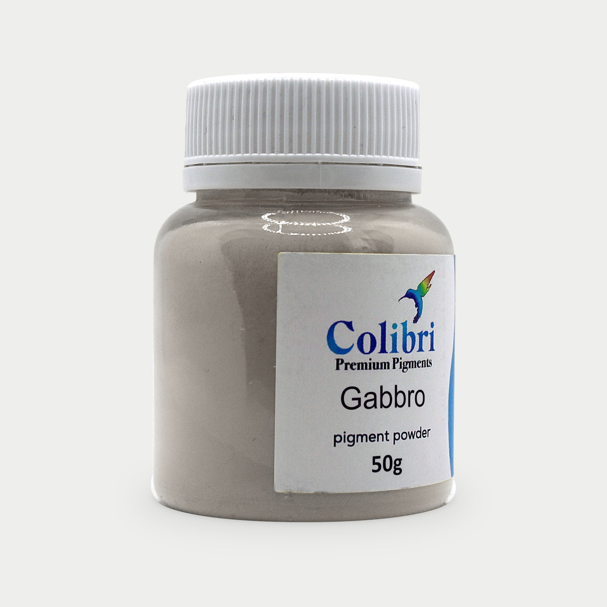 Gabbro pigment powder in a Colibri jar