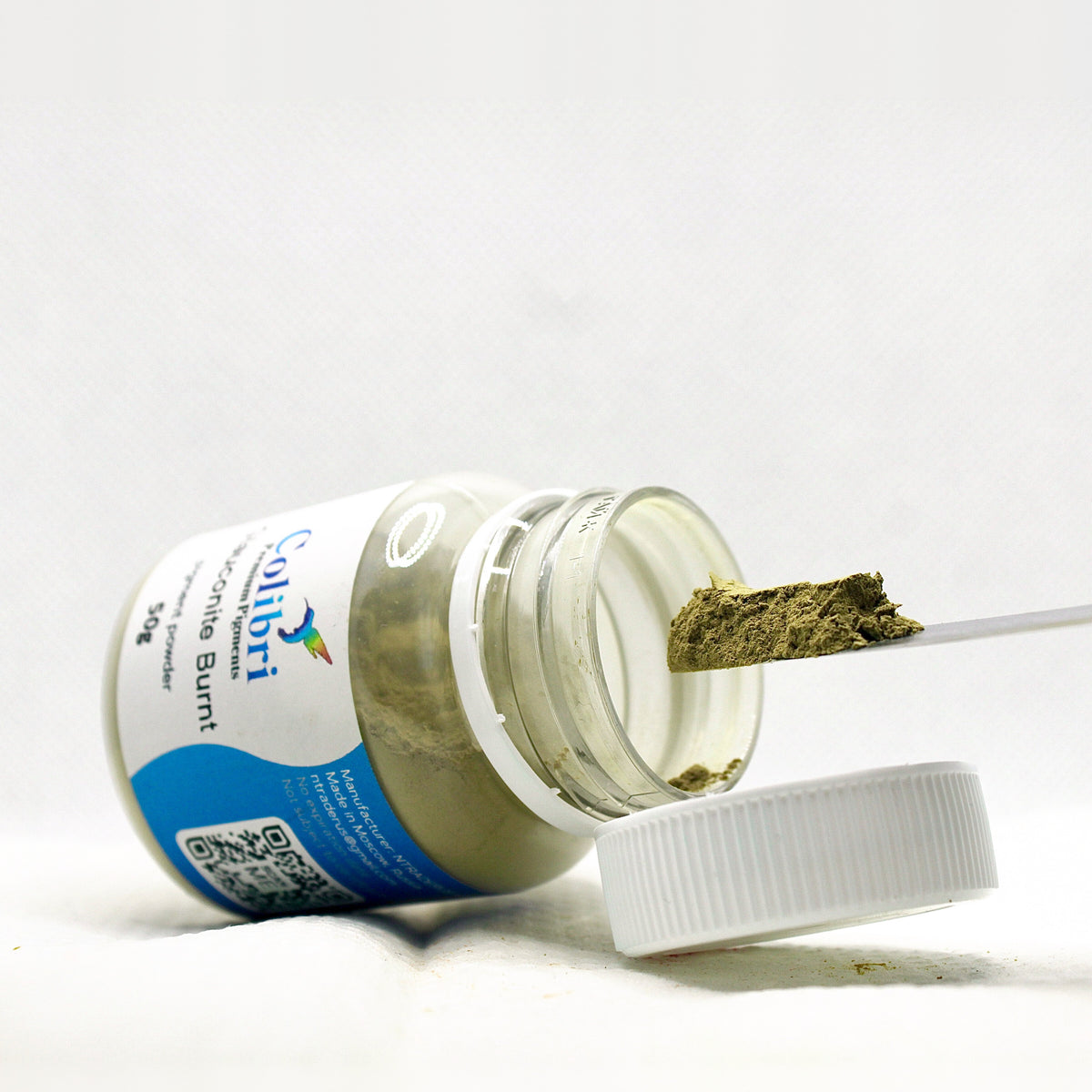 Glauconite burnt pigment powder, open jar
