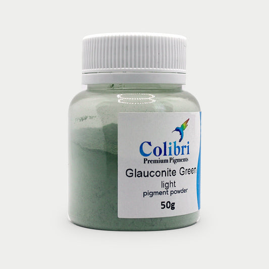 Glauconite green light pigment powder in a Colibri jar