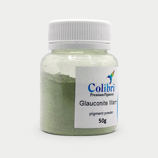Glauconite warm pigment powder in a Colibri jar