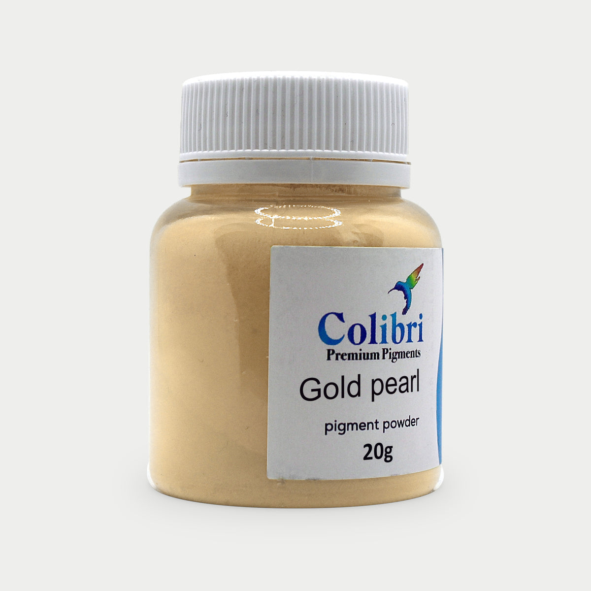 Gold pearl pigment powder in a Colibri jar
