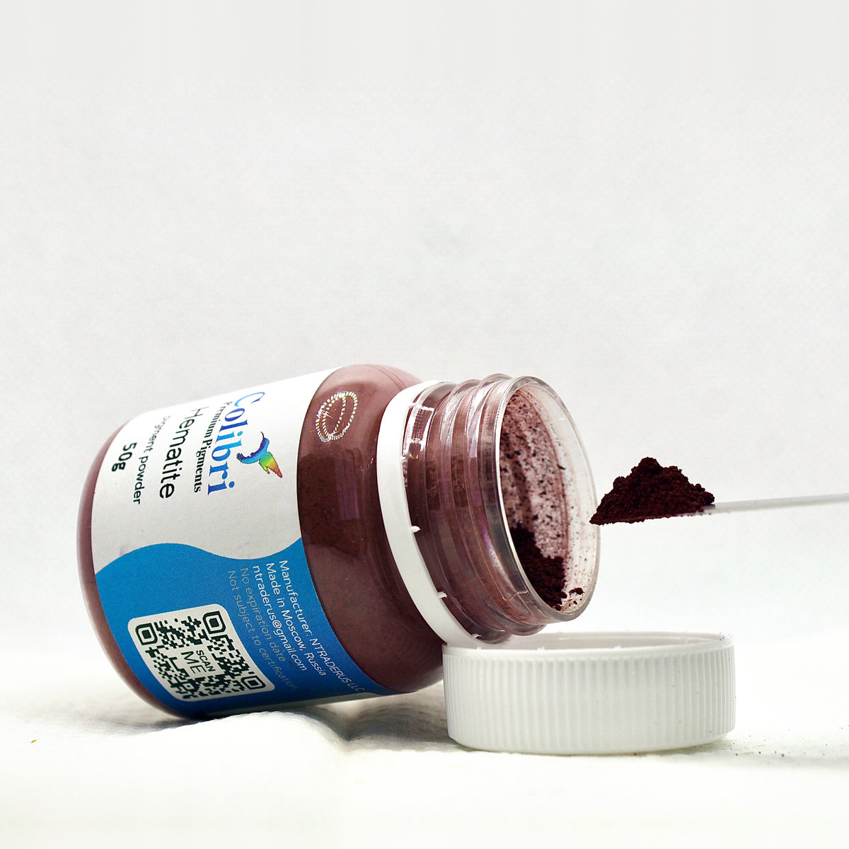 Hematite pigment powder, open jar