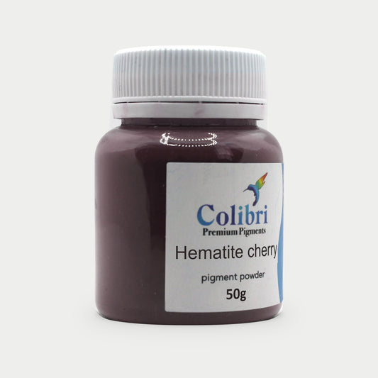 Hematite cherry pigment powder in a Colibri jar