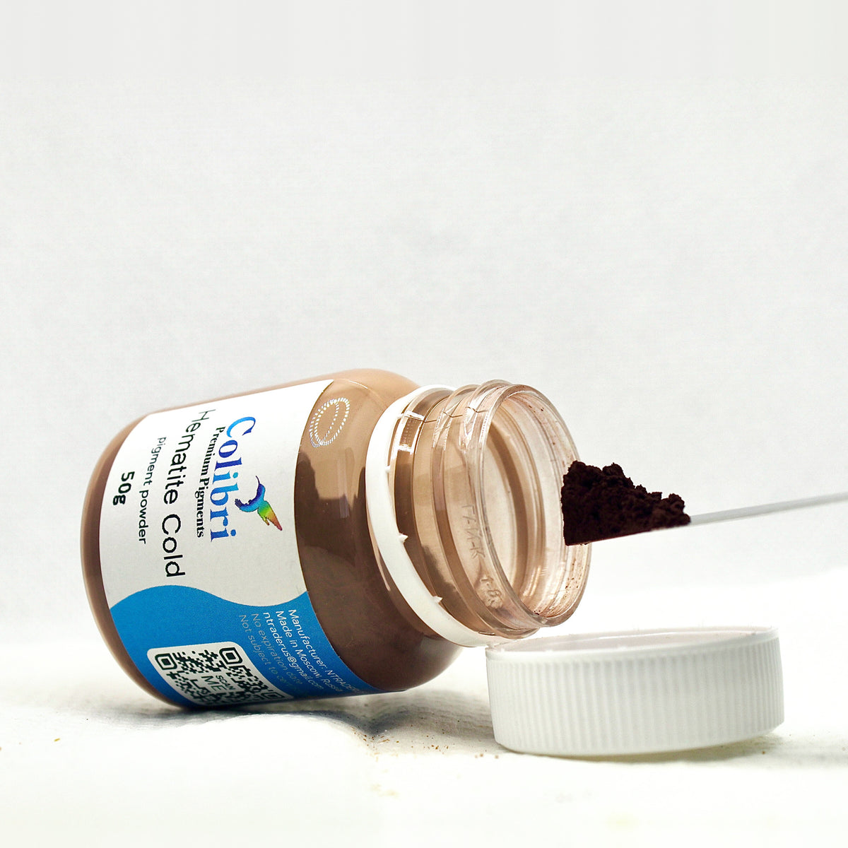 Hematite cold pigment powder, open jar