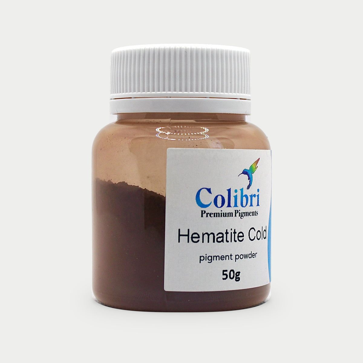 Hematite cold pigment powder in a Colibri jar