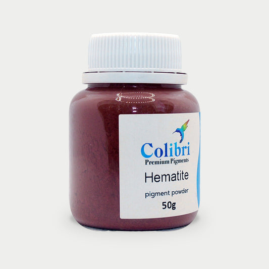 Hematite pigment powder in a Colibri jar