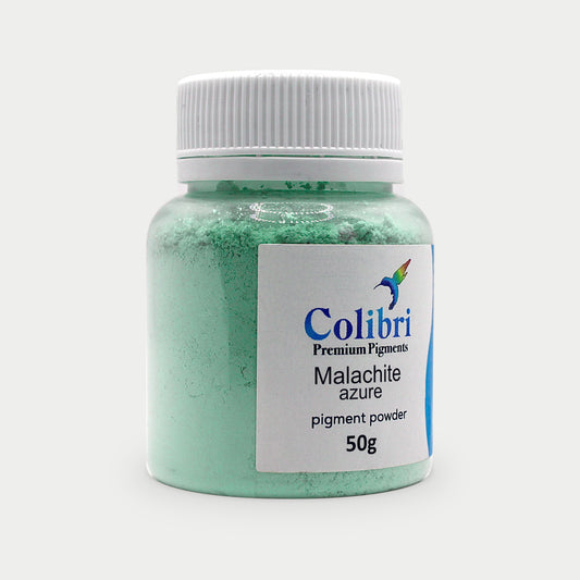 Malachite azure pigment powder in a Colibri jar