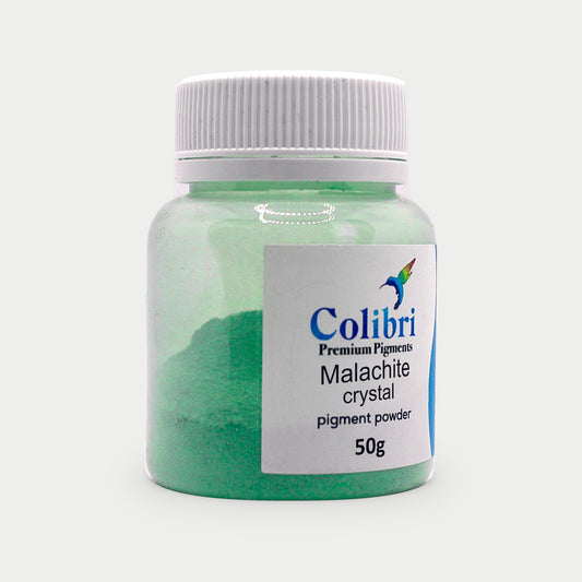 Malachite crystal pigment powder in a Colibri jar
