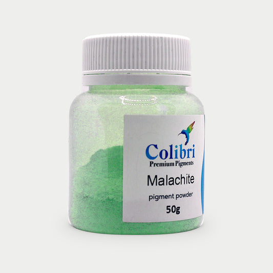 Malachite pigment powder in a Colibri jar