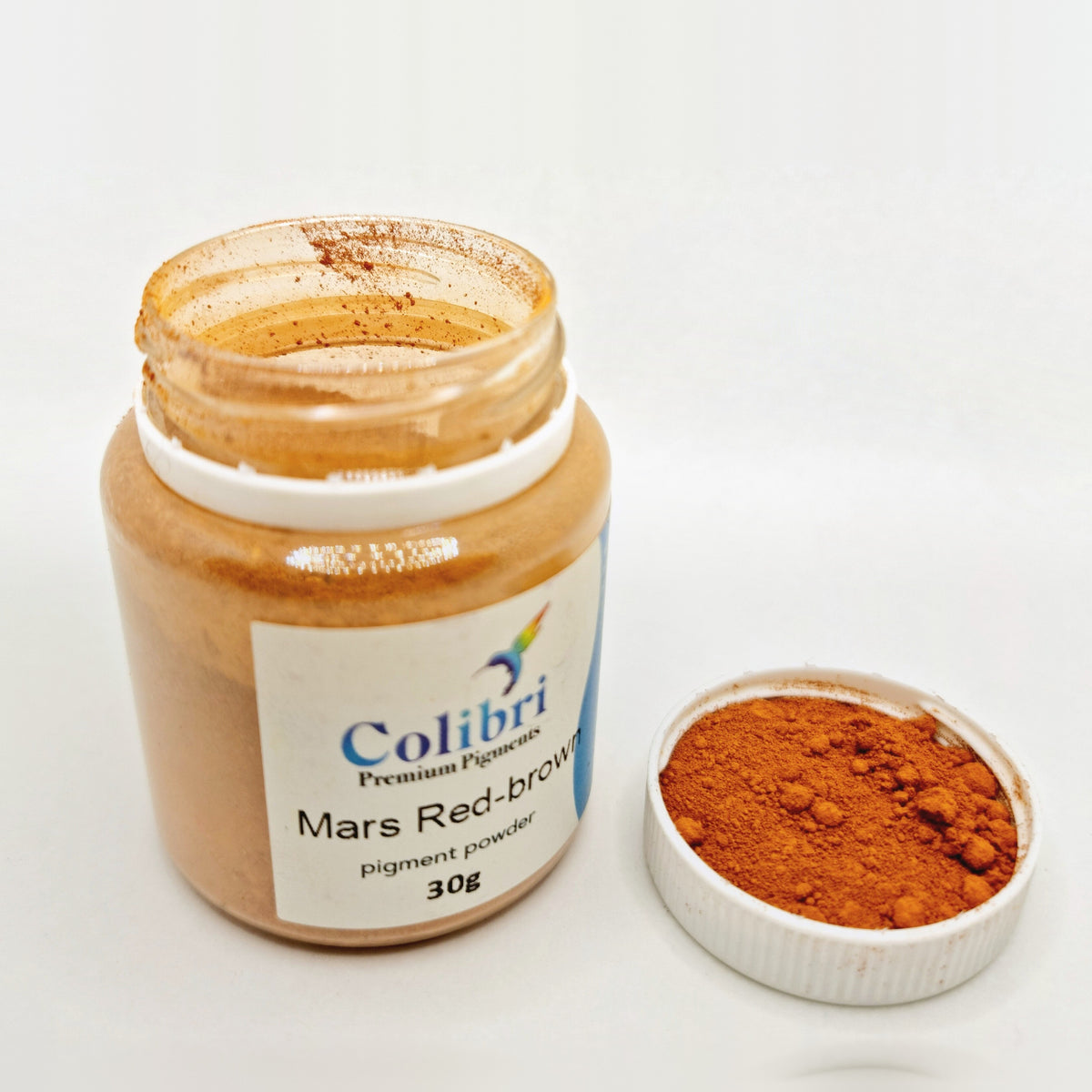 Mars red-brown pigment powder, open jar