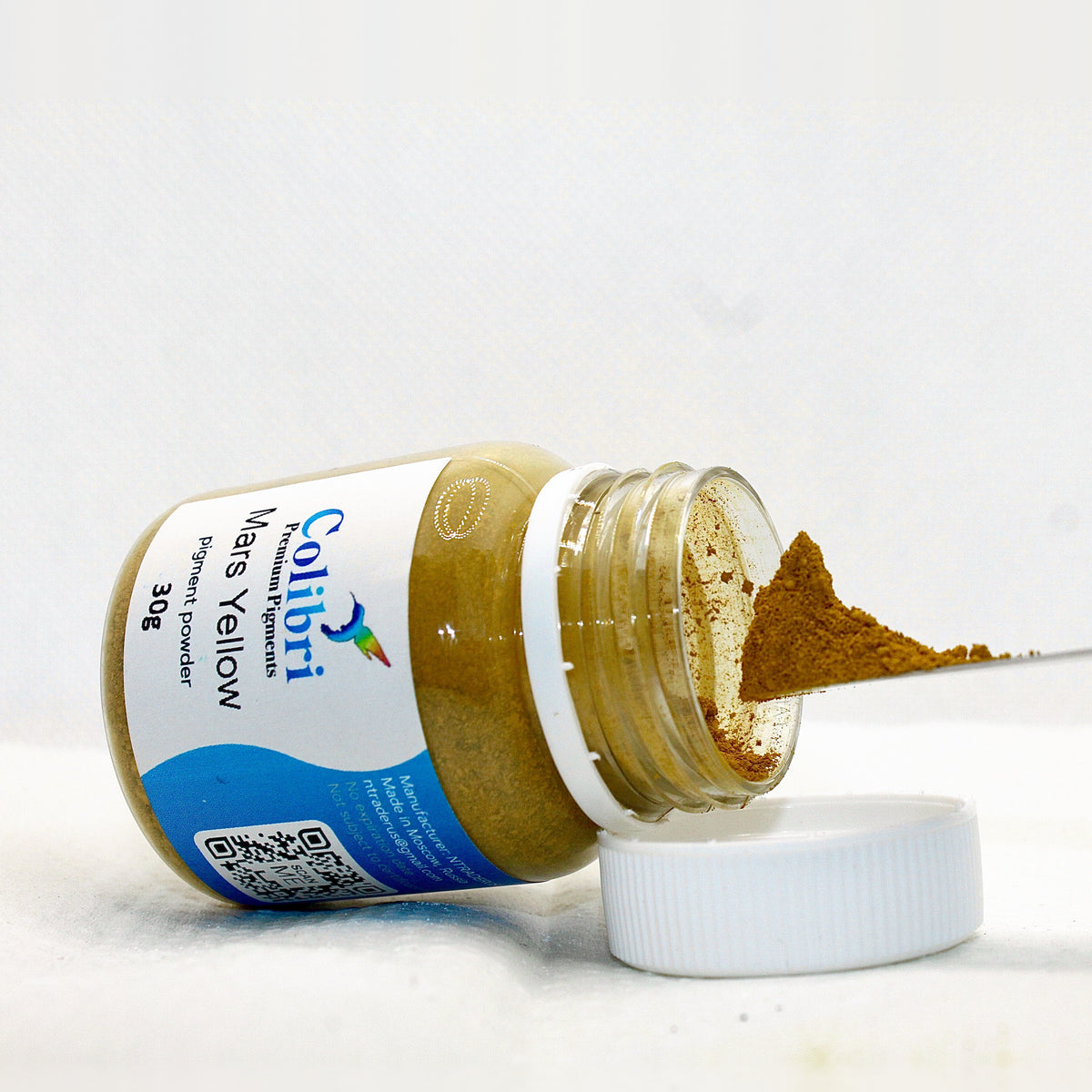 Mars yellow pigment powder, open jar