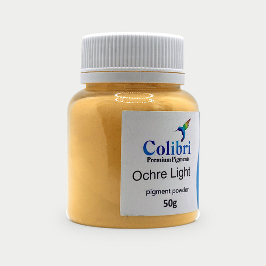 Ochre light pigment powder in a Colibri jar