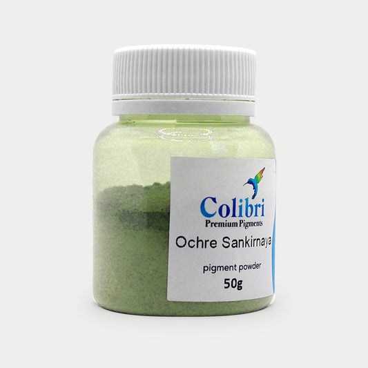 Ochre sankirnaya (Terra verte) pigment powder in a Colibri jar