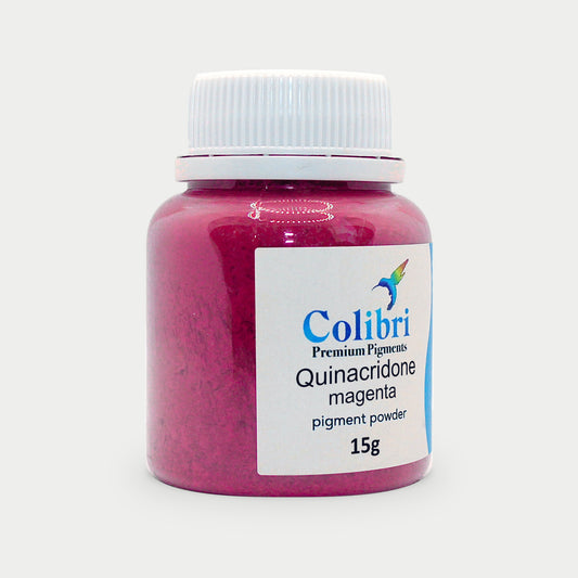 Quinacridone magenta pigment powder in a Colibri jar