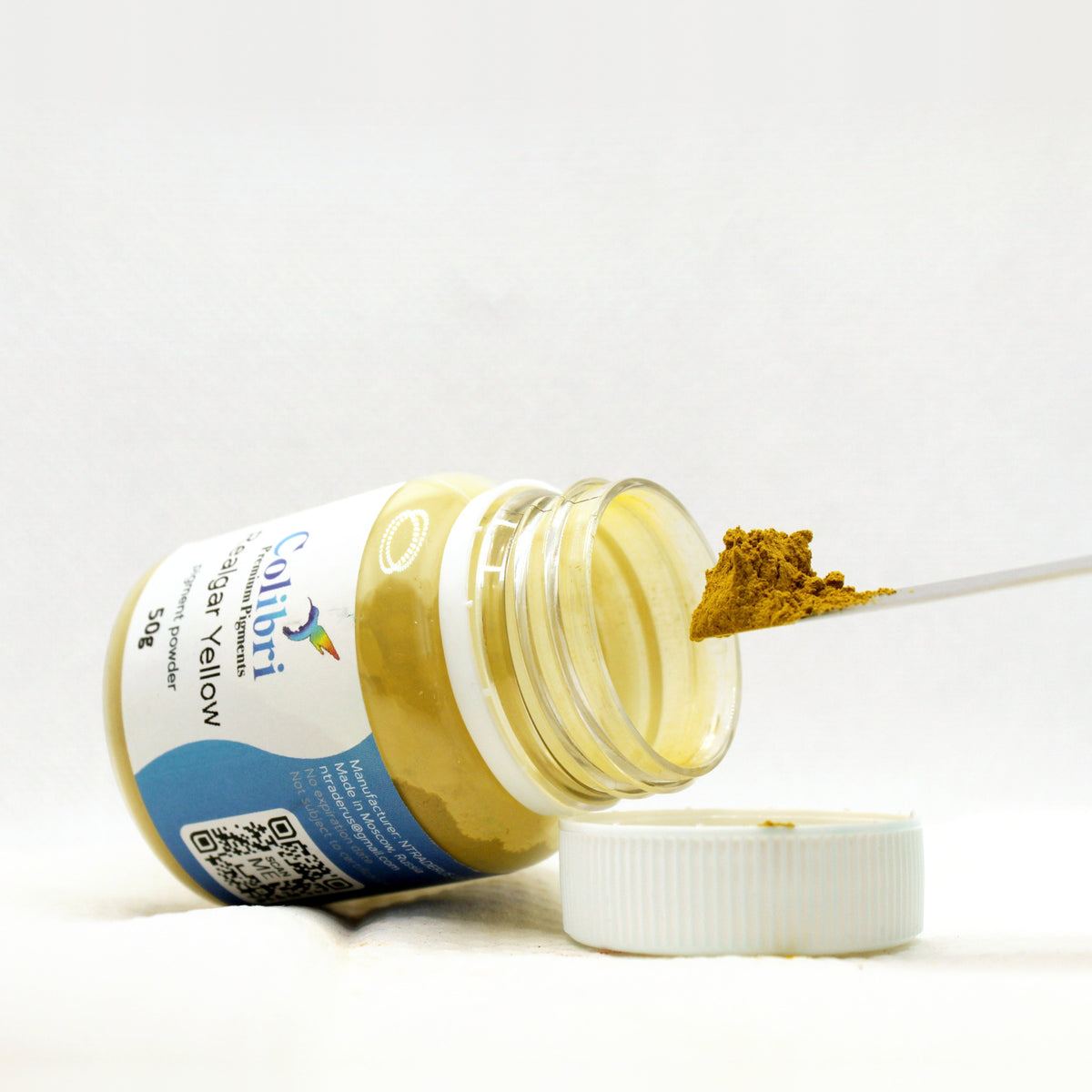 Realgar yellow pigment powder, open jar