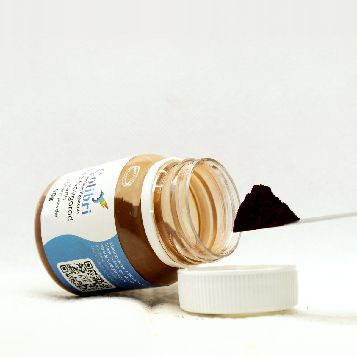Red Novgorod earth pigment powder, open jar