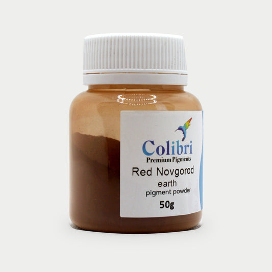 Red Novgorod earth pigment powder in a Colibri jar