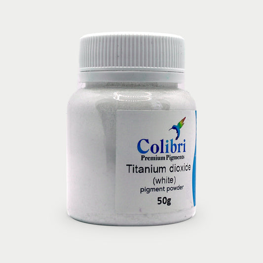 Titanium dioxide (white) pigment powder in a Colibri jar