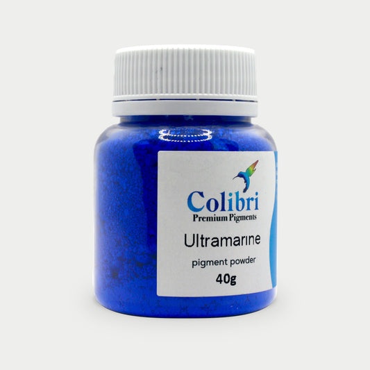 Ultramarine blue pigment powder in a Colibri jar