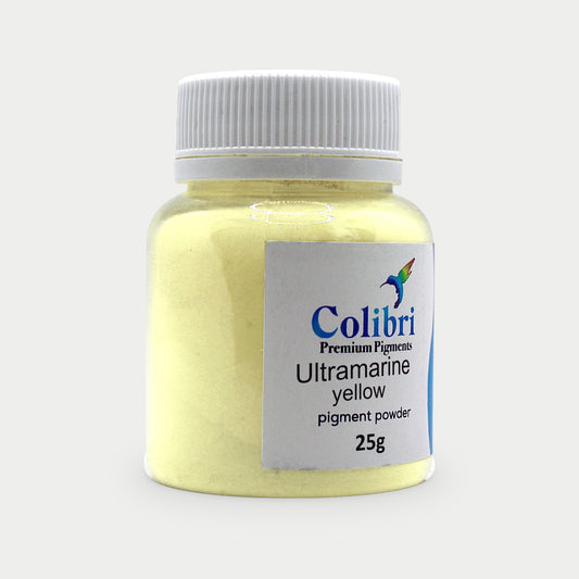 Ultramarine yellow pigment powder in a Colibri jar