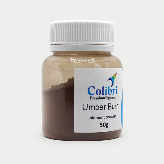 Umber burnt pigment powder in a Colibri jar