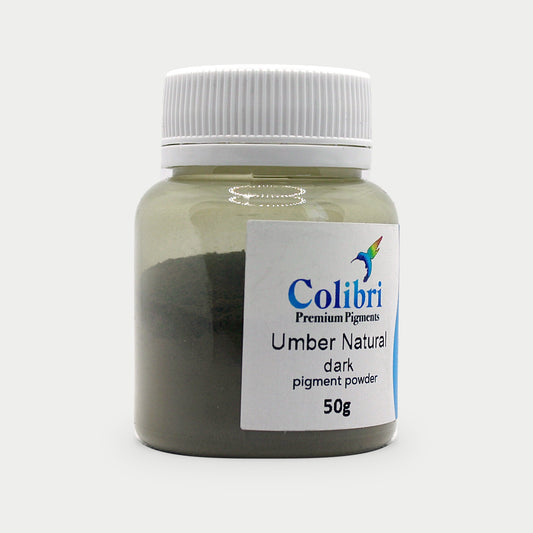 Umber natural dark pigment powder in a Colibri jar