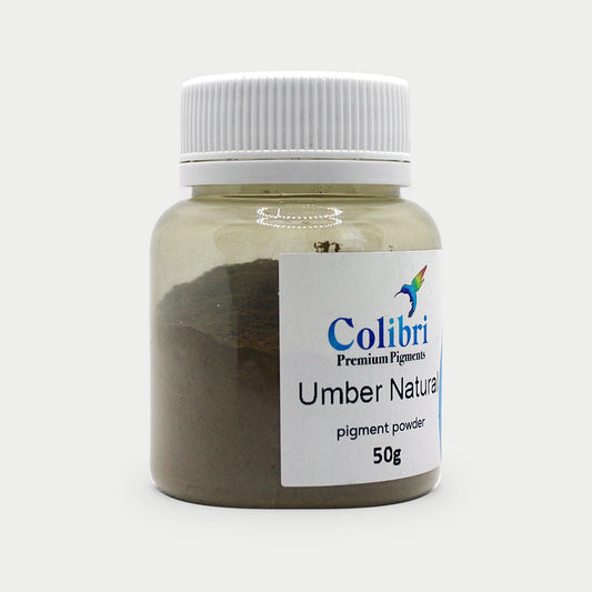 Umber natural pigment powder in a Colibri jar