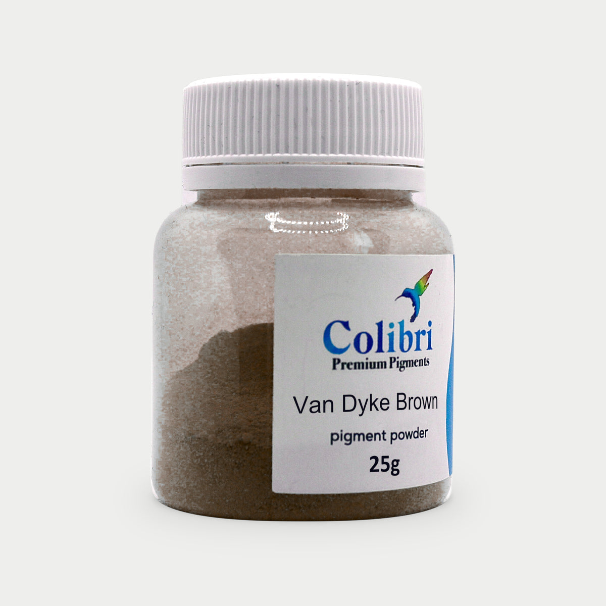 Van Dyke brown pigment powder in a Colibri jar