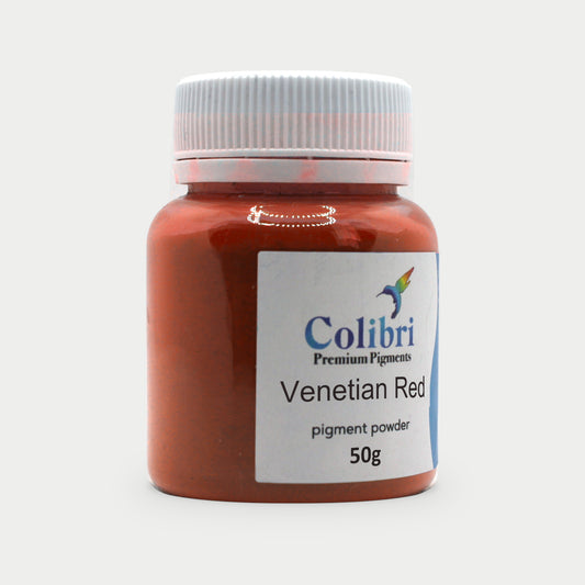 Venetian red pigment powder in a Colibri jar