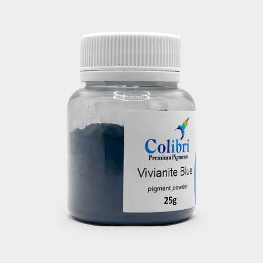 Vivianite blue pigment powder in a Colibri jar