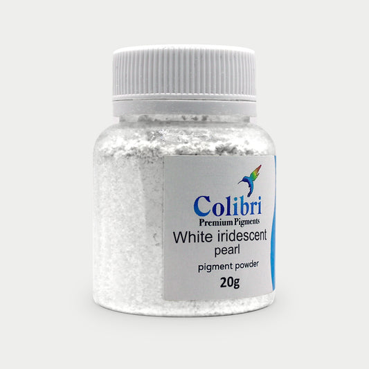 White iridescent pearl pigment powder in a Colibri jar
